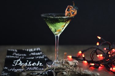 apple martini garnished with shrunken head