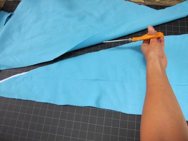 Cut two fins out of fleece fabric