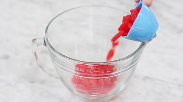 Adding Swedish fish to bowl