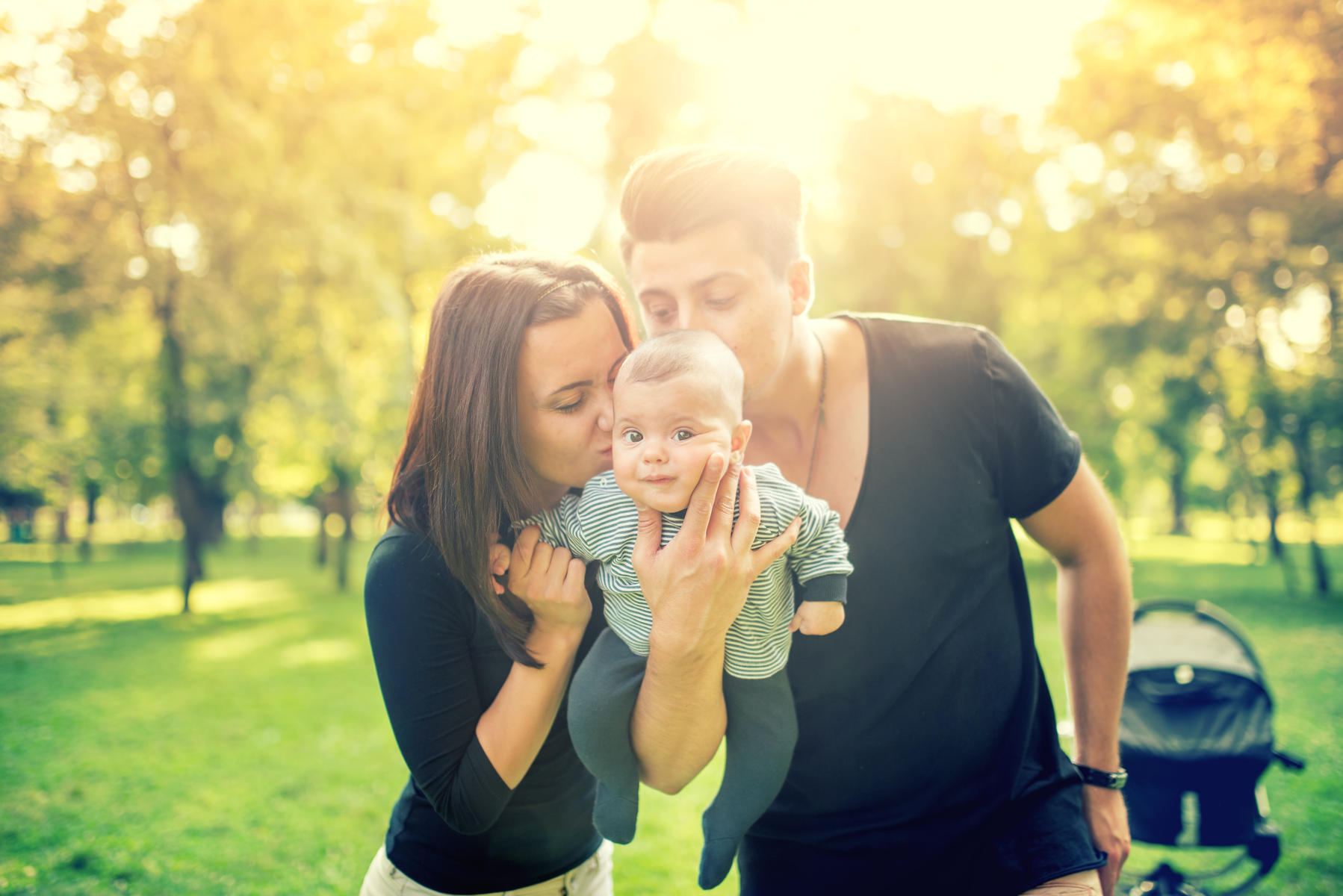 new parents holding baby