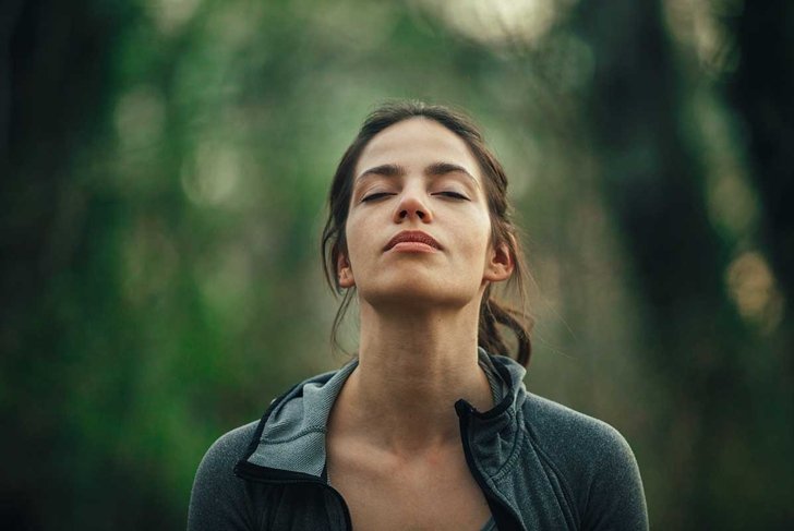 Young beautiful woman exercise in the forest